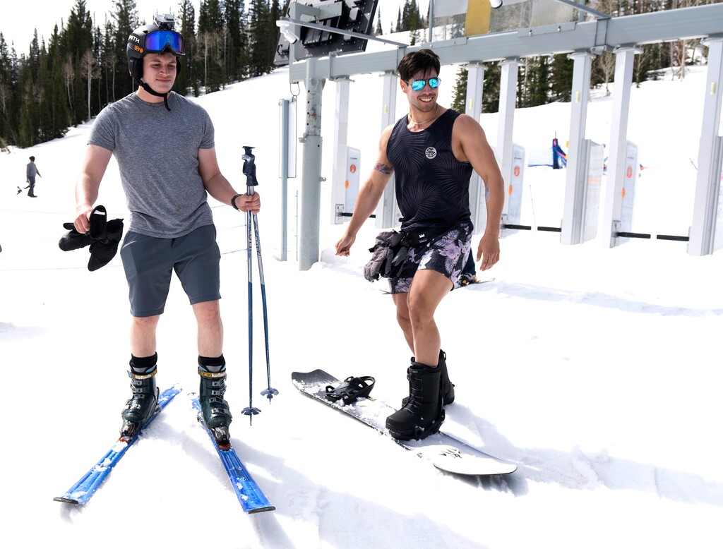 (Rick Egan | The Salt Lake Tribune)  David Fowles and Taylor Lazarus-Jaureguy dressed for spring skiing at Solitude, on Wednesday, May 3, 2023. Shorts may have been appropriate attire on the slopes last may, but this weekend and into next week, more than a foot of snow is expected to fall in the mountains, with perhaps a dusting hitting the Salt Lake Valley as well.