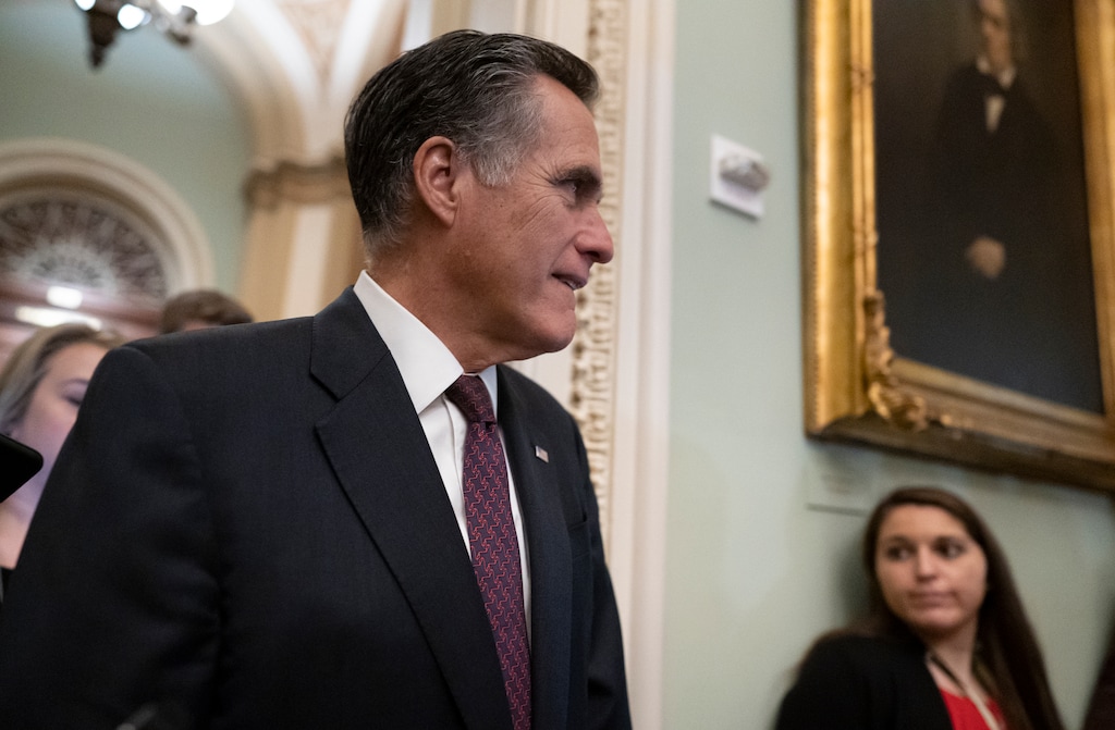 (J. Scott Applewhite | AP) Sen. Mitt Romney, R-Utah, is questioned by reporters during the impeachment trial of President Donald Trump on charges of abuse of power and obstruction of Congress, at the Capitol in Washington, Tuesday, Jan. 28, 2020.