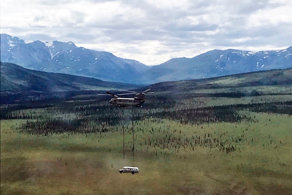 (Sgt. Seth LaCount/Alaska National Guard via AP) In this photo released by the Alaska National Guard, Alaska Army National Guard soldiers use a CH-47 Chinook helicopter to airlift an abandoned bus, popularized by the book and movie "Into the Wild," out of its location in the Alaska backcountry in light of public safety concerns, as part of a training mission Thursday, June 18, 2020. Alaska Natural Resources Commissioner Corri Feige, in a release, said the bus will be kept in a secure location while her department weighs various options for what to do with it.