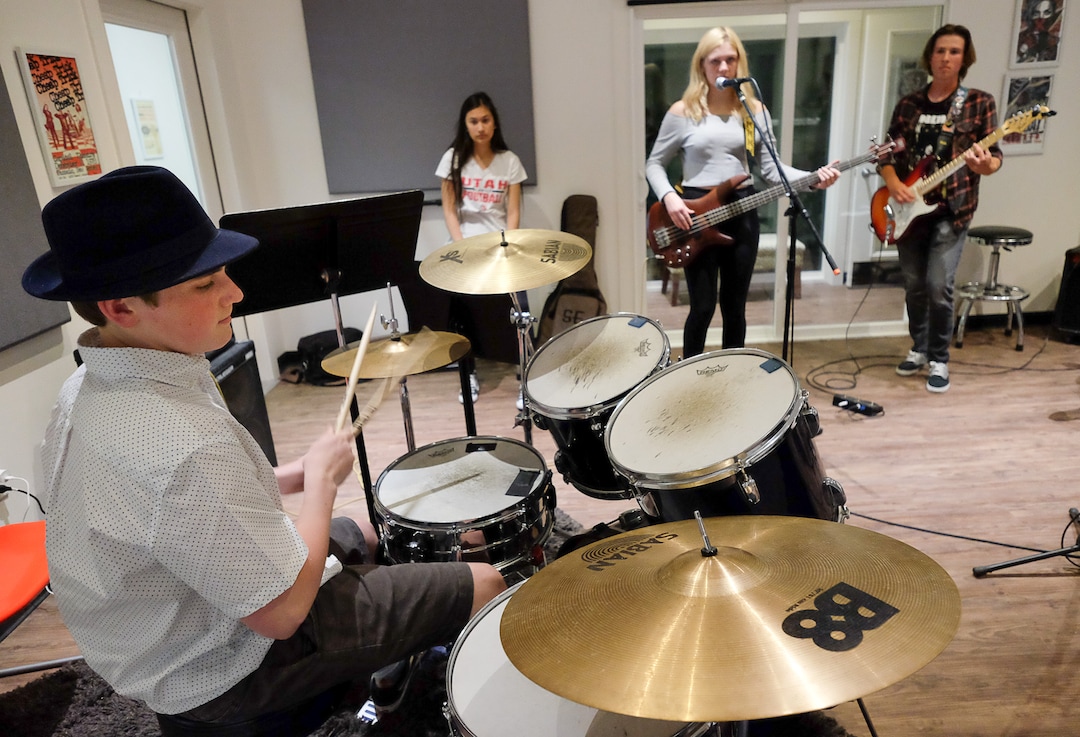 (Francisco Kjolseth  |  The Salt Lake Tribune)  Miles Buchmann, 15, plays the drums as he joins other students in the after school program MusicGarage.org, in Sugarhouse on Monday, May 20, 2019.