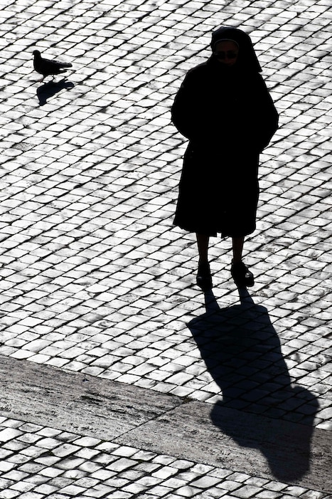 (AP Photo/Pier Paolo Cito, File) In this Sunday, Dec. 20, 2009, photo, a nun is silhouetted in St. Peter's Square at the Vatican. Some nuns are now finding their voices, buoyed by the #MeToo movement and the growing recognition that adults can be victims of sexual abuse when there is an imbalance of power in a relationship. The sisters are going public in part because of years of inaction by church leaders, even after major studies on the problem in Africa were reported to the Vatican in the 1990s.