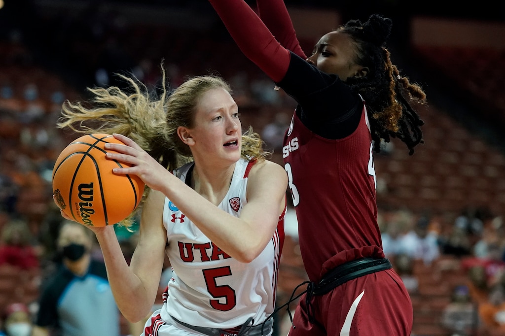 Utah guard Gianna Kneepkens (5) drives around Arkansas guard Makayla Daniels, right, during the first half of a college basketball game in the first round of the NCAA women's tournament, Friday, March 18, 2022, in Austin, Texas. (AP Photo/Eric Gay)