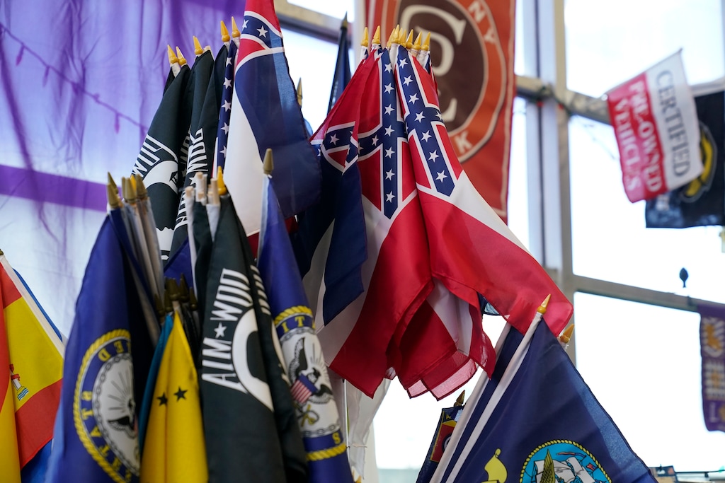 (Rogelio V. Solis | AP photo)

A display stand has a strand of the recently retired Mississippi state flag, mixed with military flags, state flags and special interest flags Tuesday, Oct. 27, 2020, at A Complete Flag Source store in Jackson, Miss.