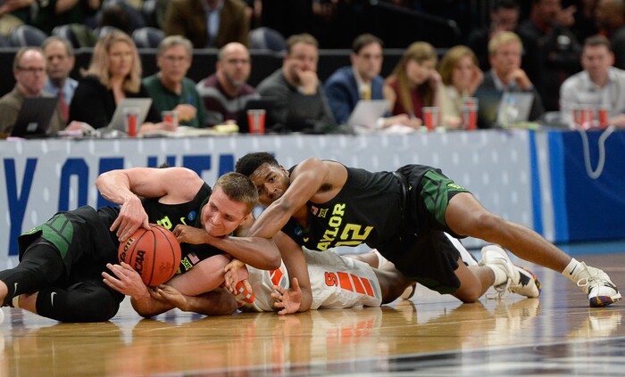 (Francisco Kjolseth  |  The Salt Lake Tribune)  Syracuse Orange forward Elijah Hughes (33) gets between Baylor Bears guard Makai Mason (10) and Baylor Bears guard Jared Butler (12) as Syracuse faces Baylor in their first round menÕs NCAA March Madness tournament game at Vivint Smart Home Arena in Salt Lake City on Thursday, March 21, 2019.