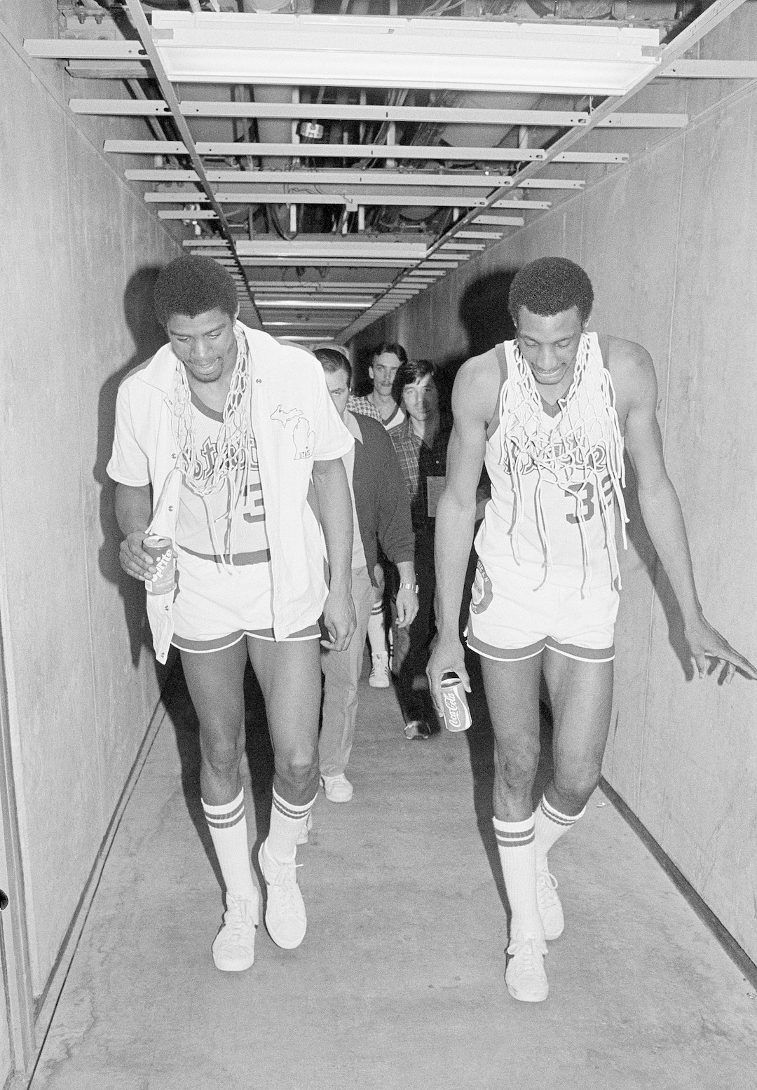(AP Photo) Earvin "Magic" Johnson, left, who was named the NCAA tournament's most valuable player, walks with teammate Greg Kelser as they head for the dressing room after defeating Indiana State 75-64 to win the NCAA tournament Monday, March 27, 1979 in Salt Lake City.