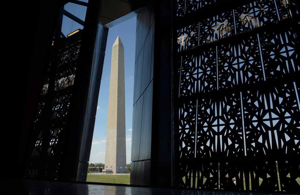 (AP Photo/Susan Walsh) The Washington Monument is framed by a window at the National Museum of African American History and Culture in Washington, Wednesday, Sept. 14, 2016.