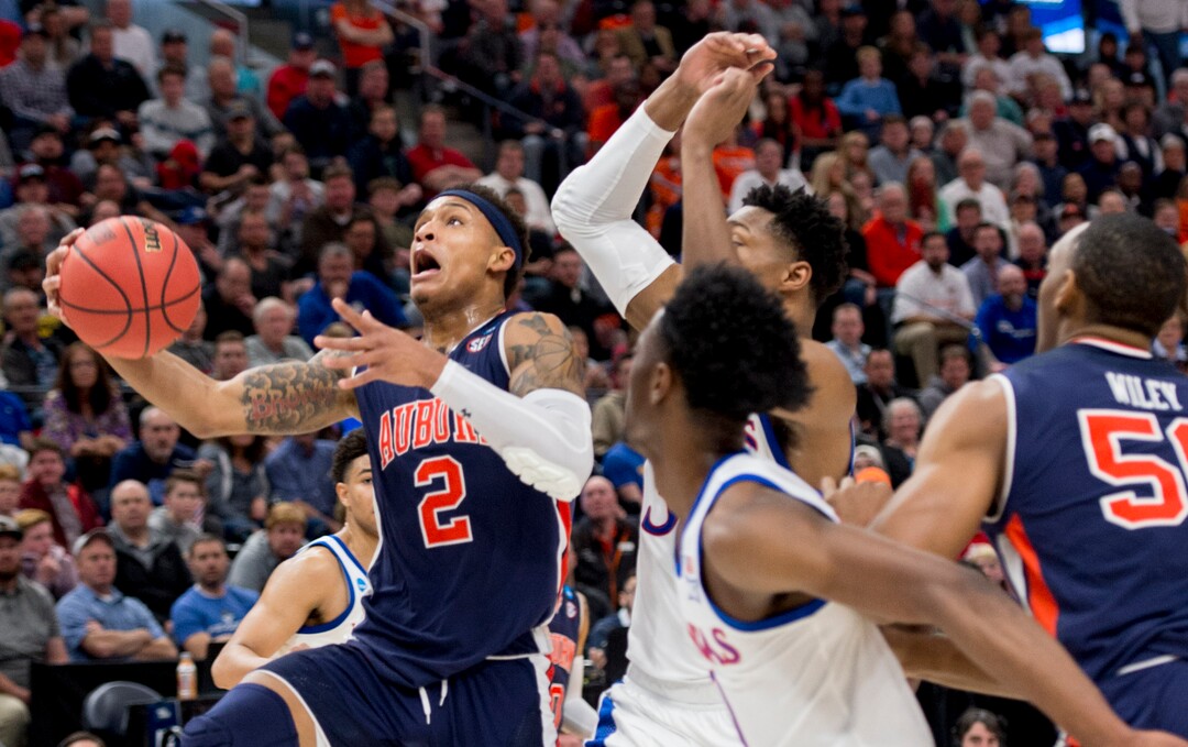 (Leah Hogsten  | The Salt Lake Tribune)  Auburn Tigers guard Bryce Brown (2) drives to the basket as Auburn faces Kansas in the second round of the NCAA tournament in Salt Lake City on Saturday, March 23, 2019.