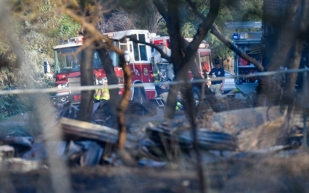 (Francisco Kjolseth  |  The Salt Lake Tribune)  Fire crews remain on the scene where three homes were destroyed by wildfire in Bountiful along the East bench that grew to 150 acres early Friday morning, Aug. 30, 2019.