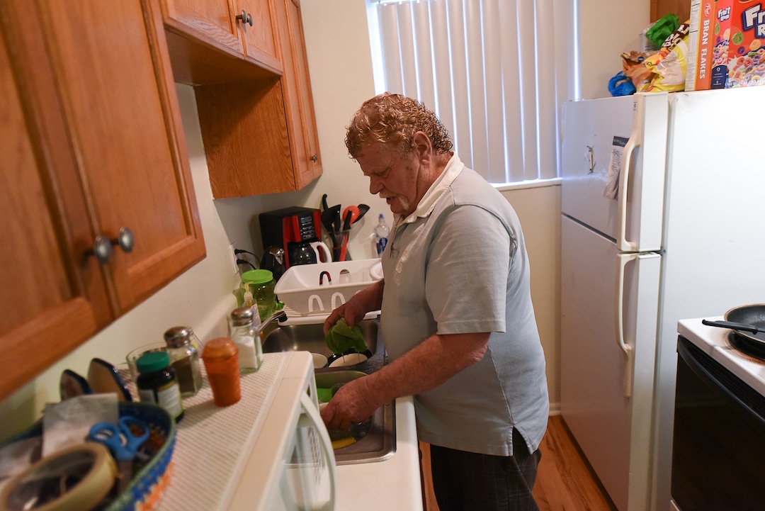 (Francisco Kjolseth  |  The Salt Lake Tribune)  Darwin Osborn, 64, is a Vietnam veteran who was homeless and searched for housing for over a year before landing a one-bedroom apartment in April 2019. He likes to keep a tidy place as he washes dishes in his kitchen. Osborn was housed with a VASH voucher and additional barrier removal support through additional funding provided by the state's "100 More Housed" initiative.