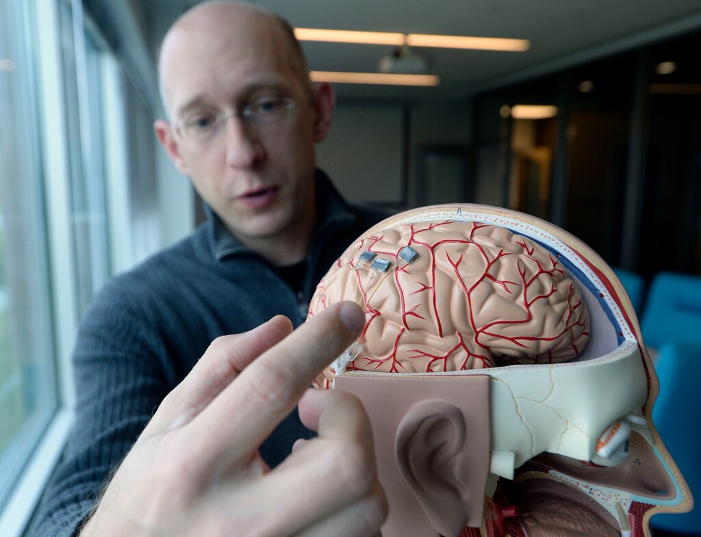 (Al Hartmann | The Salt Lake Tribune)
Florian Solzbacer, president-executive chairman of Blackrock shows the computer chip they developed that is implanted in the brain of amputees or paraplegics. The chip allows them to move robotic devices like prosthetic limbs.