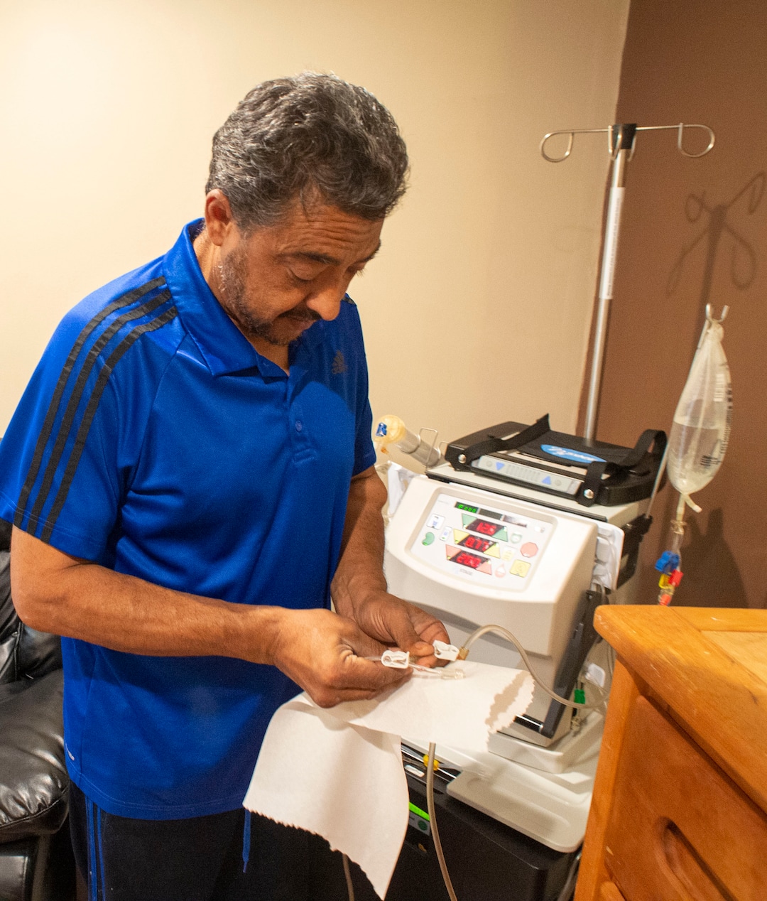 (Rick Egan  |  The Salt Lake Tribune)     Raul Gutierrez goes through the steps to setup his machine, as an in-home dialysis patient. Thursday, Sept. 5, 2019.