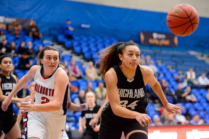 (Trent Nelson | The Salt Lake Tribune)  Highland's Misini Fifita (34) pulls in a rebound as Woods Cross faces Highland in the 5A High School Girls' Basketball Tournament at SLCC in Taylorsville, Wednesday Feb. 21, 2018.