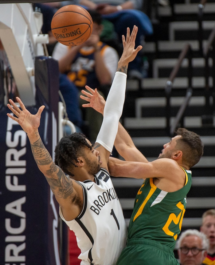 (Rick Egan  |  The Salt Lake Tribune)   Utah Utah Jazz guard Raul Neto (25) bends around Brooklyn Nets guard D'Angelo Russell (1) for a shot in NBA action between Utah Jazz and Brooklyn Nets at Vivint Smart Home Arena, Saturday, March 16, 2019.


