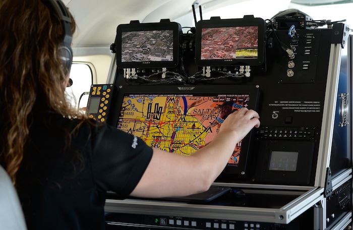 (Francisco Kjolseth  |  Francisco Kjolseth)  Amber Surrency, an aerial research photographer for CoStar Group Inc., documents downtown Salt Lake City on Friday, June 8, 2018, from the air of a specially equipped Cessna Grand Caravan EX. CoStar Group Inc., a research and technology company provides information to commercial real estate professionals, including those in Utah.