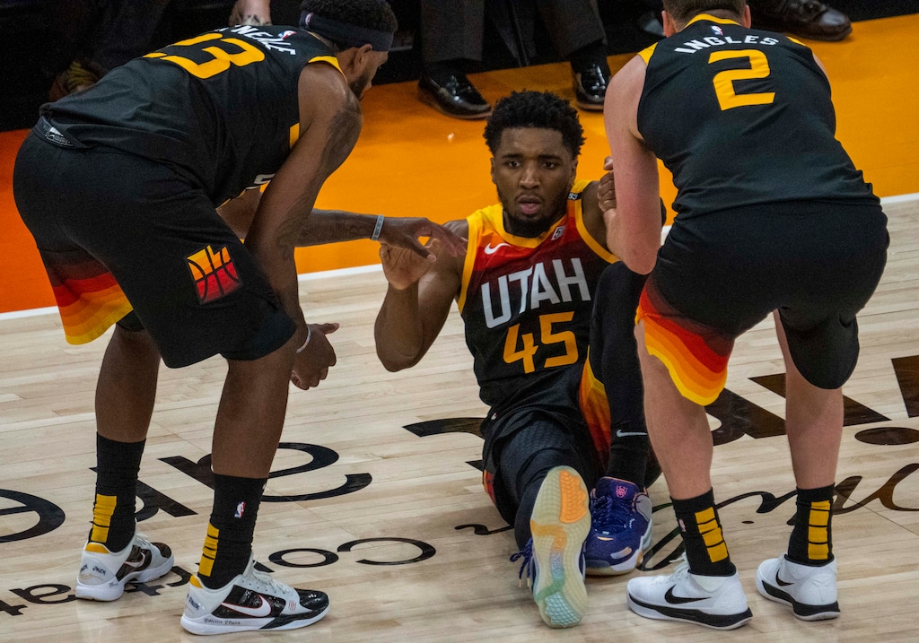 (Rick Egan | The Salt Lake Tribune) Utah Jazz guard Donovan Mitchell (45) is slow getting to his feet after being fouled by LA Clippers guard Paul George (13), in Game 2 of the Western Conference Semifinals at Vivint Arena, on Thursday, June 10, 2021.