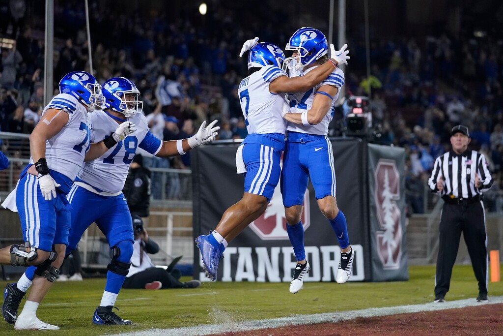 BYU running back Hinckley Ropati (7) celebrates with wide receiver Chase Roberts, right, after a 43-yard touchdown against Stanford during the first half of an NCAA college football game in Stanford, Calif., Saturday, Nov. 26, 2022. (AP Photo/Godofredo A. Vásquez)