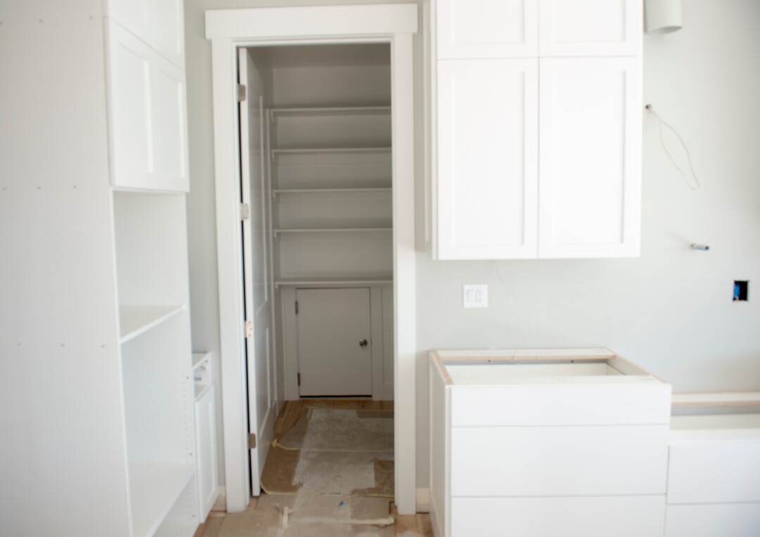 (Rick Egan  |  The Salt Lake Tribune)    Pantry with a door form the garage, in a custom home in Riverton, Monday, Sept. 24, 2018.
