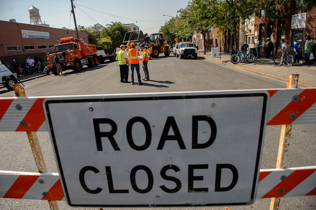 (Trent Nelson | The Salt Lake Tribune)  Workers install barriers on Rio Grande in Salt Lake City to prevent auto traffic in hopes of stopping the drug traffic around the area, Friday September 1, 2017.