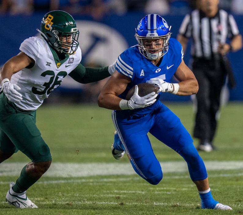 (Rick Egan | The Salt Lake Tribune)  Baylor Bears linebacker Tyrone Brown (36) chases Brigham Young Cougars tight end Dallin Holker (5), in football action between the Brigham Young Cougars and the Baylor Bears at LaVell Edwards Stadium in Provo, on Saturday, Sept. 10, 2022.
