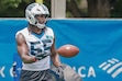 Carolina Panthers linebacker Devin Lloyd tosses a ball during a drill at the team's NFL football practice in Charlotte, N.C., Tuesday, June 9, 2026. (AP Photo/Nell Redmond)