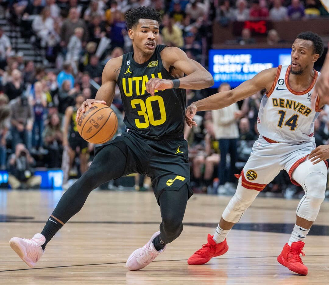 (Rick Egan | The Salt Lake Tribune) Utah Jazz guard Ochai Agbaji (30) takes the ball inside as Denver Nuggets guard Ish Smith (14) defends, in NBA action between the Utah Jazz and the Denver Nuggets at Vivint Arena,  Saturday, April 8, 2023.