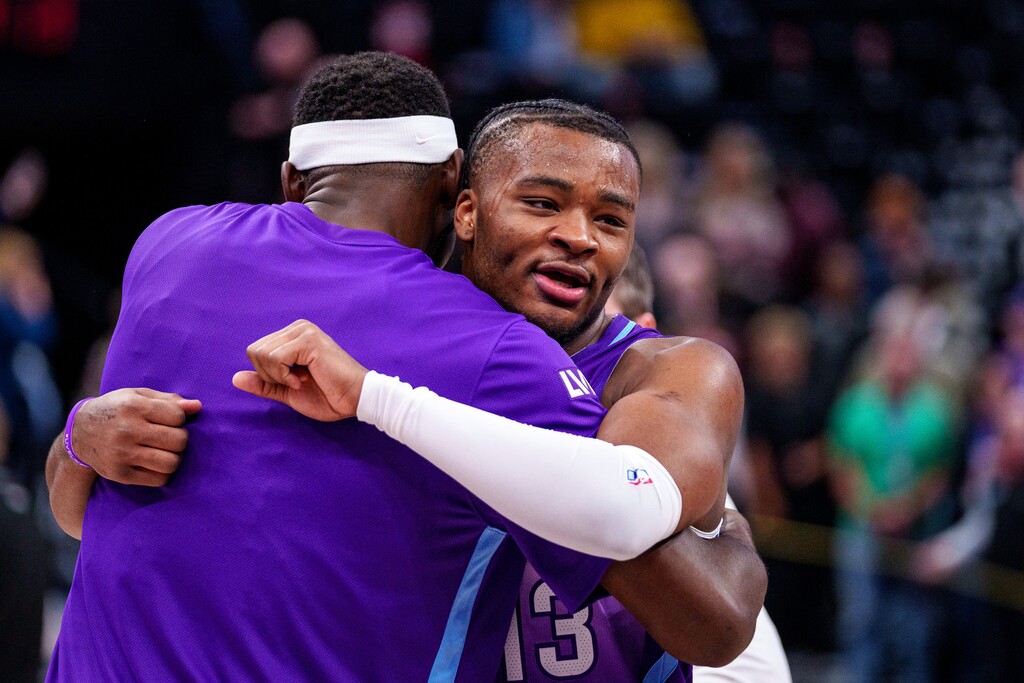 (Trent Nelson  |  The Salt Lake Tribune) Utah Jazz guard Isaiah Collier (13) embraces Utah Jazz center Oscar Tshiebwe (34) as the Utah Jazz defeat the Washington Wizards, NBA basketball in Salt Lake City on Wednesday, March 19, 2025.