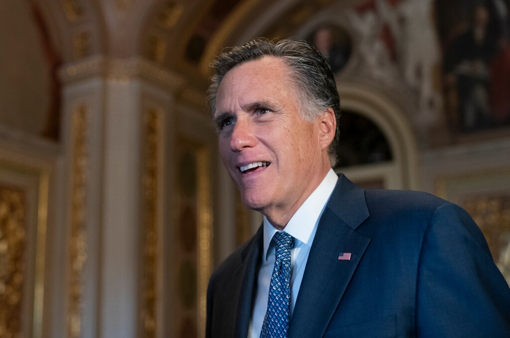 (J. Scott Applewhite | AP file photo)  Sen. Mitt Romney, R-Utah, talks to a reporter outside the Senate chamber during a break in President Donald Trump's impeachment trial, at the Capitol in Washington, Wednesday, Jan. 29, 2020.