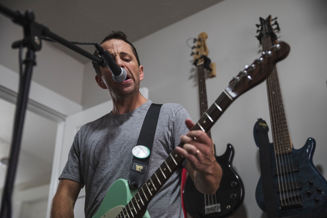 (Clark Clifford  |  For The Salt Lake Tribune) Bryce Taylor sings and plays guitar during a practice for an upcoming show in the band's rehearsal space in Orem on Saturday, Aug. 3, 2019.