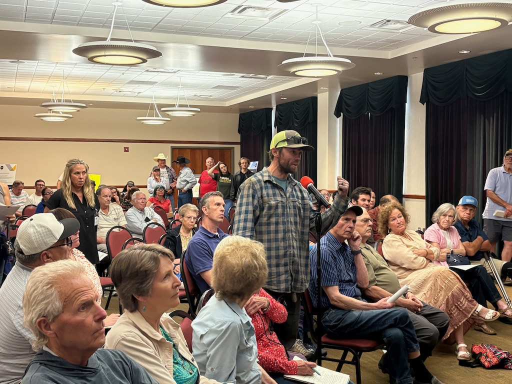 (Brooke Larsen | The Salt Lake Tribune) A resident raises concerns and questions about the proposed Red Butte energy campus and data center in Iron County during an open house in Cedar City on Thursday, May 14, 2026.