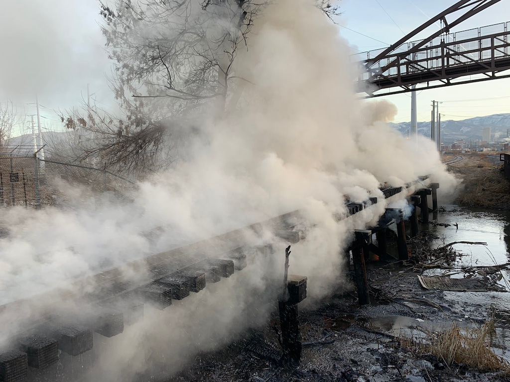 Courtesy of the Salt Lake City Fire Department
A bridge that spans the Jordan river burned Thursday and Friday, filling the Fairpark and Rose Park neighborhoods of Salt Lake City with smoke and causing concern over the fumes.