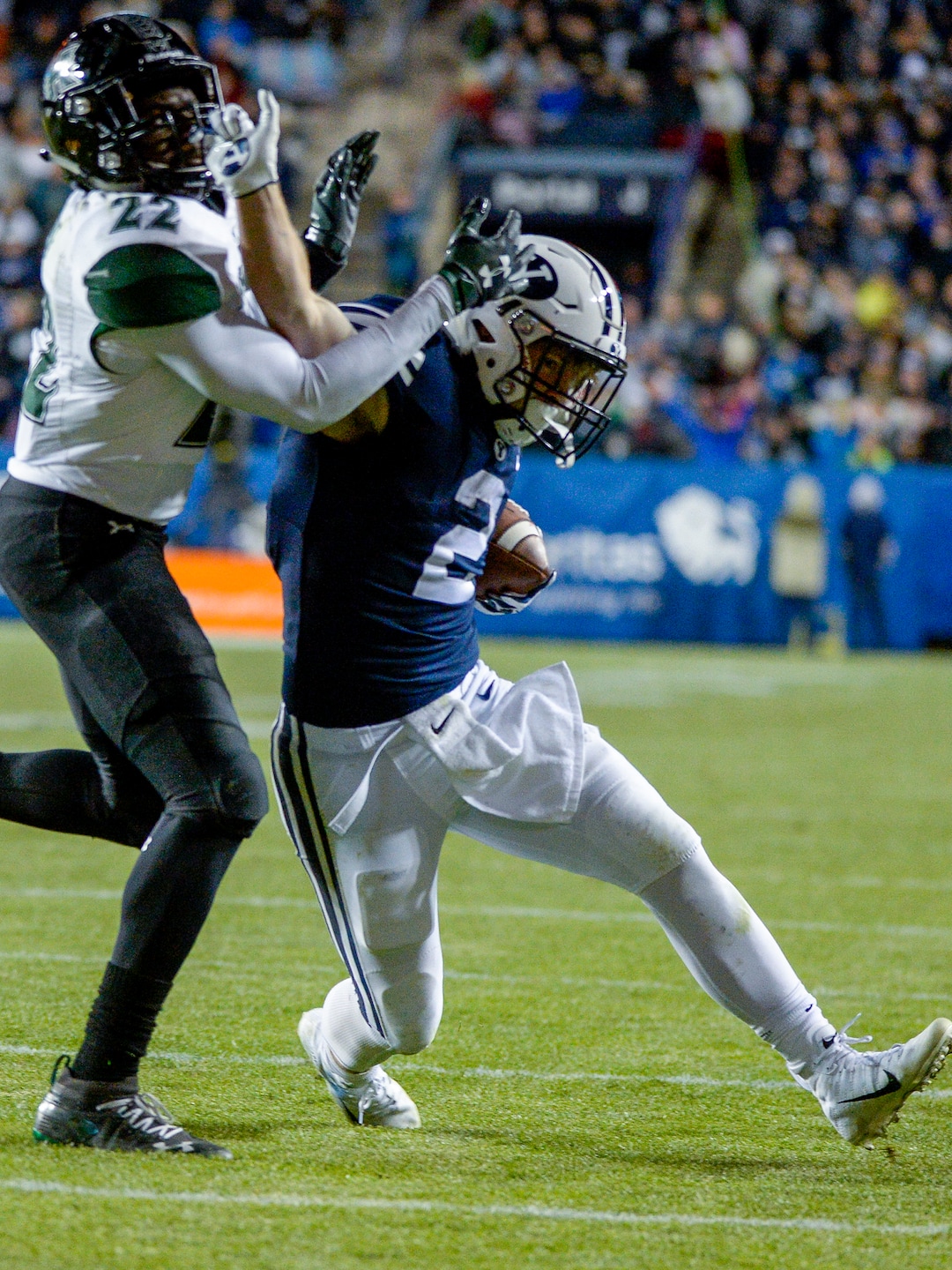 Leah Hogsten  |  The Salt Lake Tribune Brigham Young Cougars running back Matt Hadley (2) attempts to hold off Hawaii defensive back Ikem Okeke (22) as Brigham Young University hosts Hawaii at Lavell Edwards Stadium in Provo, Saturday Oct. 13, 2018. BYU defeated Hawaii 49-23.