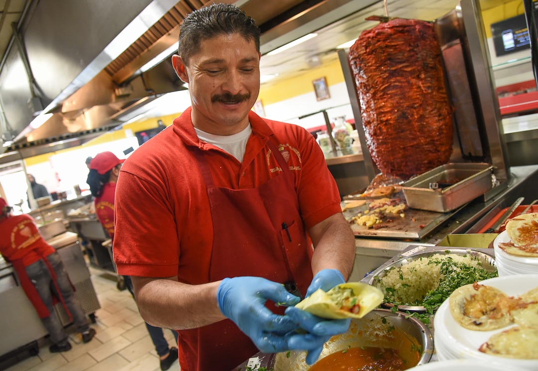 (Francisco Kjolseth  |  The Salt Lake Tribune)  Raul Aispuro assembles tacos al pastor, the most popular offering at Tacos Mi Caramelo, a late-night taqueria that is open until 2 a.m. most nights and 24-hours a day on Friday and Saturday in West Valley City.