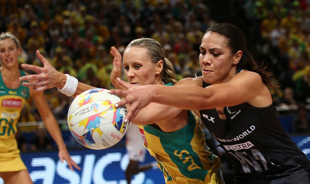 Australia's Renae Hallinan, left, and New Zealand's Grace Rasmussen stretch for the ball during their Netball World Cup gold medal match in Sydney Sunday, Aug. 16, 2015. Australia won the final match. Hallinan now is married to Joe Ingles. (AP Photo/Rob Griffith)