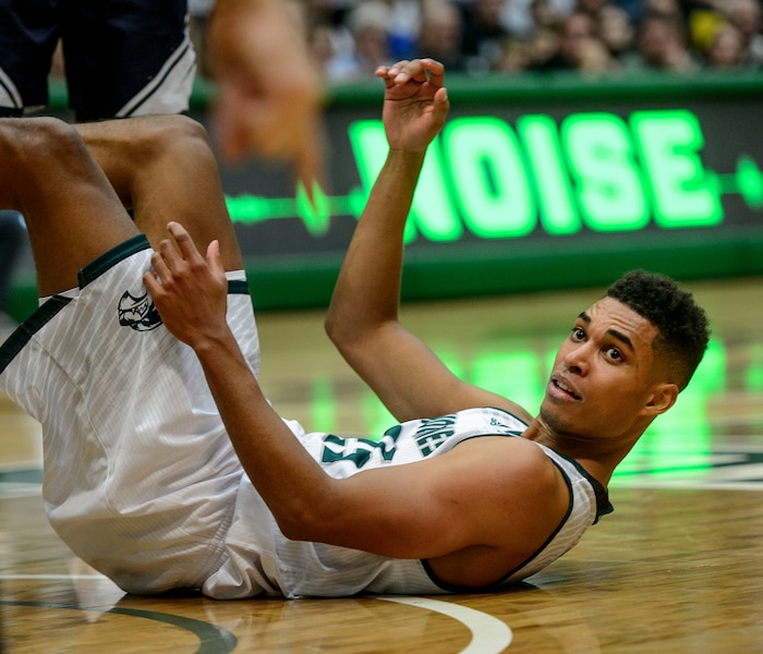 (Steve Griffin  |  The Salt Lake Tribune) Utah Valley Wolverines guard Kenneth Ogbe (25) looks at the ref from the floor after no foul was called during the BYU versus UVU basketball game at UCCU Center on the UVU campus in Orem Wednesday November 29, 2017.