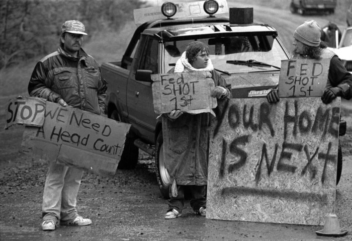 FILE - This Aug. 23, 1992, file photo shows Randy Weaver supporters at Ruby Ridge in northern Idaho. It's been a quarter century since a standoff in the remote mountains of northern Idaho left a 14-year-old boy, his mother and a federal agent dead and sparked the expansion of radical right-wing groups across the country that continues to this day. (AP Photo/Jeff T. Green, File)
