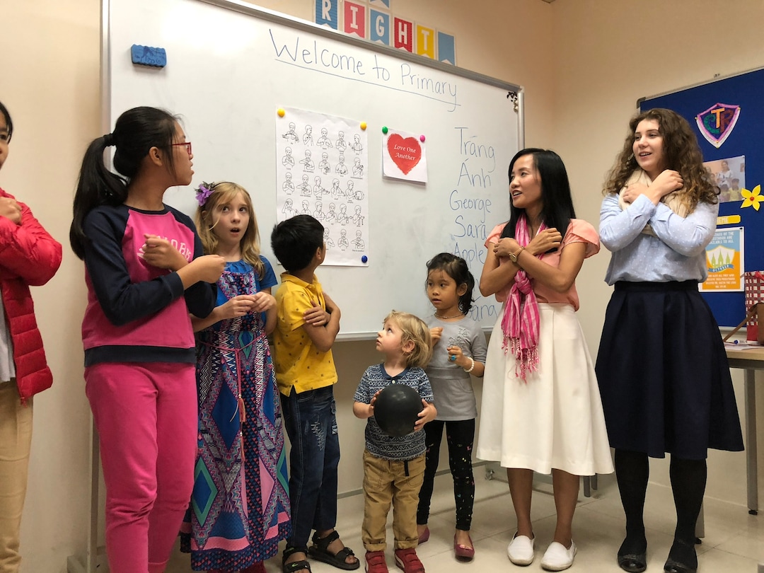 (Mike Stack for The Salt Lake Tribune) Sister missionaries Thuy Anh and Reagan Moss teach Primary song in sign language in Hanoi LDS branch.