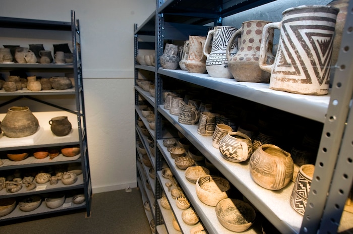 (Al Hartmann | The Salt Lake Tribune) Some of the 900 Anasazi pots line several large racks at the Edge of the Cedars State Park Museum west of Blanding on June 12, 2009. The 900 pots are part of the Shumway, Holliday and Perkins collection donated to the Utah-Navajo Trust Fund. They are permanently housed at the Edge of the Cedars Museum.