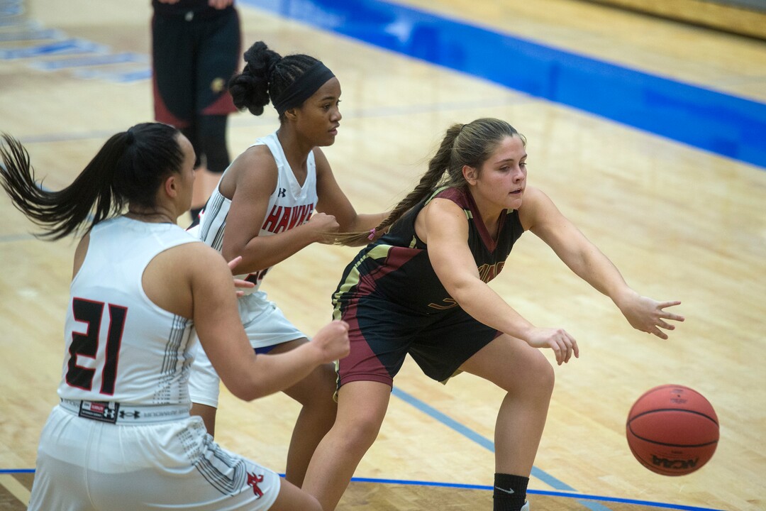 (Chris Detrick  |  The Salt Lake Tribune)  Viewmont's Madi Toole (31) passes around Alta's Eden Broederlow (21) and Alta's Mina Sete (32) during the game at Pleasant Grove High School Thursday, November 30, 2017.  Viewmont defeated Alta 65-44.