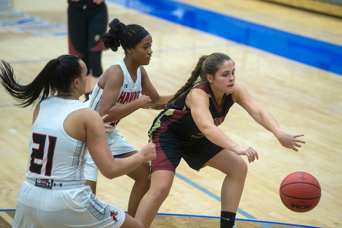 (Chris Detrick | The Salt Lake Tribune) Viewmont's Madi Toole (31) passes around Alta's Eden Broederlow (21) and Alta's Mina Sete (32) during the game at Pleasant Grove High School Thursday, November 30, 2017. Viewmont defeated Alta 65-44.