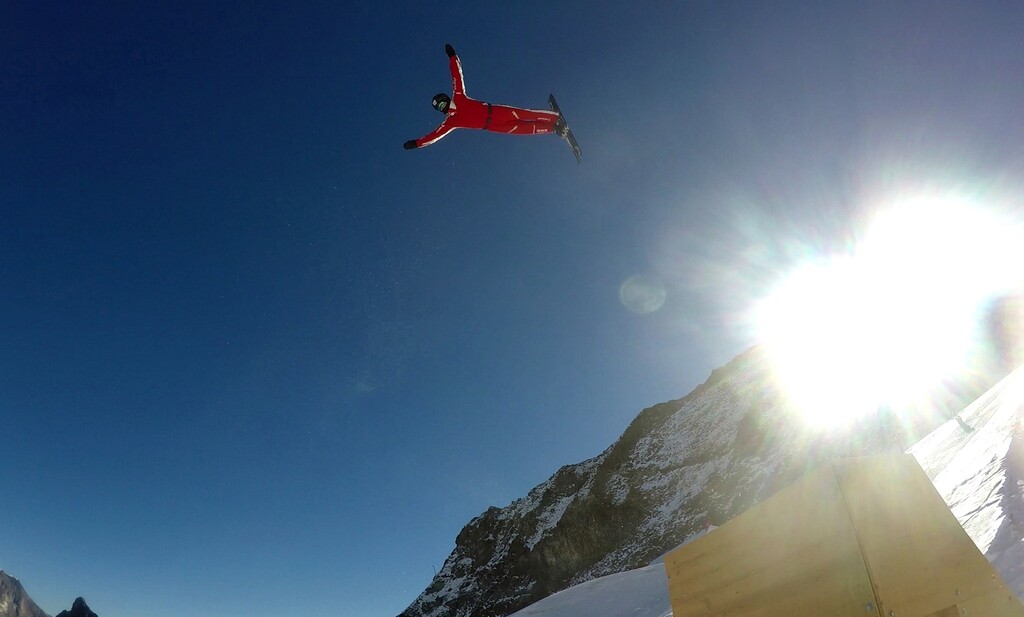 (John Leicester | The Associated Press) This photo taken from a 4K video and dated Tuesday, Oct. 17, 2017 shows Swiss aerial skier Mischa Gasser as he performs a jump during training on the glacier above Saas-Fee, Switzerland. The glacier attracted skiers and snowboard athletes from an array of nations, who came hunting for snow on which to train early in the season ahead of the 2018 Pyeongchang Olympics.