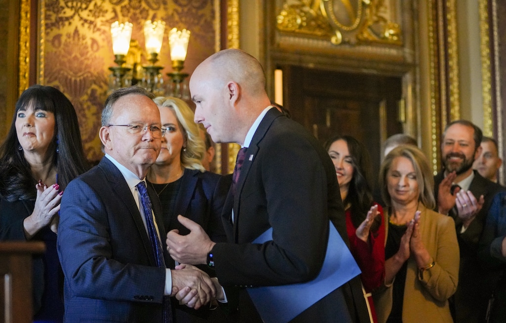 (Chris Samuels | The Salt Lake Tribune) Gov. Spencer Cox, center, shakes hands with Senate President Stuart Adams, R-Layton, during a news conference at the Capitol in Salt Lake City, Friday, Feb. 28, 2025.