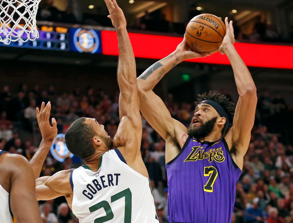 Los Angeles Lakers center JaVale McGee (7) shoots as Utah Jazz center Rudy Gobert (27) defends during the first half of an NBA basketball game Friday, Jan. 11, 2019, in Salt Lake City. (AP Photo/Rick Bowmer)