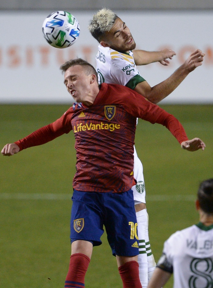 (Leah Hogsten  |  The Salt Lake Tribune) Real Salt Lake forward Corey Baird (10) and Portland Timbers midfielder Cristhian Paredes (22) take a header as Real Salt Lake hosts the Portland Timbers, Oct. 14, 2020.