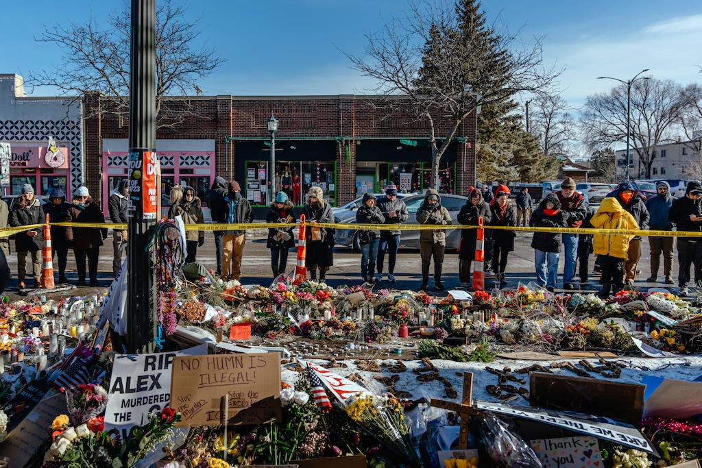 (Jamie Kelter Davis | The New York Times) People in Minneapolis on Monday, Jan. 26, 2026, view the impromptu memorial for Alex Pretti, a nurse who was fatally shot by Department of Homeland Security agents on Saturday. President Donald Trump appeared to be trying to quell the outcry over his immigration crackdown in Minneapolis on Monday, deploying his border czar to oversee operations there and taking a cooperative tone with the governor he has blamed for the killings of two U.S. citizens by federal agents.