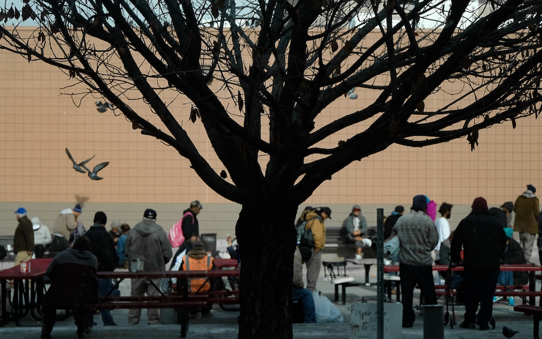(Francisco Kjolseth  |  The Salt Lake Tribune) People spend time in the courtyard of the Weigand Center in downtown Salt Lake City, as they wait for lunch services on Wednesday, Dec. 18, 2019. The American Civil Liberties Union recommends policy decisions come with considerable input from people experiencing homelessness, who are best positioned to offer a sense of how the community will be affected. Catholic Community Services is one organization that is seeking that input, through surveys at kiosks created by Pulse for Good, a Utah-based company, at the Weigand Center and its new homeless resource center in Salt Lake City. The surveys ask about service, cleanliness and what people would like to see at its locations.