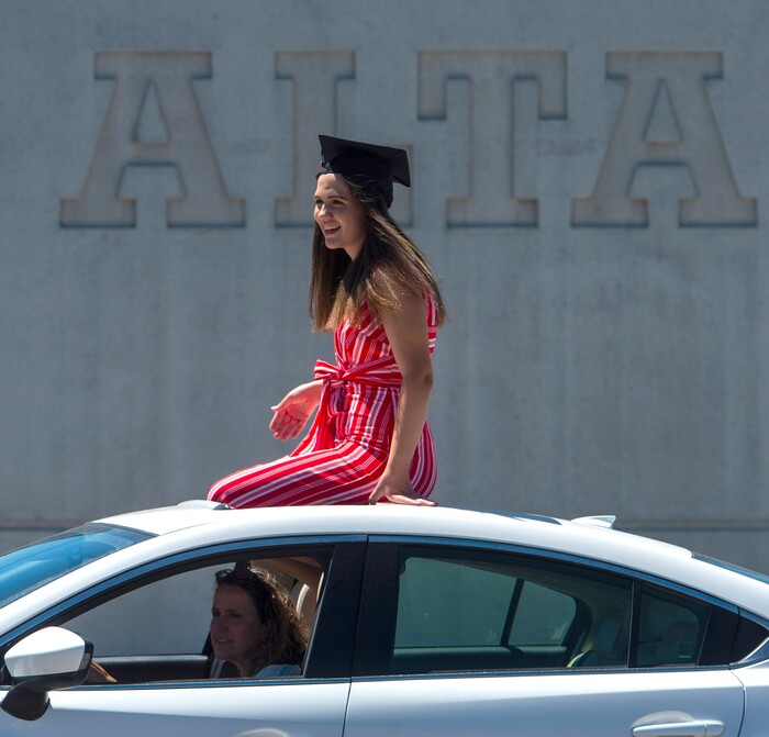 (Rick Egan  |  The Salt Lake Tribune)     Alta Hugh Senior, Danika Lasson, rides in the parade of 2020 graduates in a “drive through” graduation ceremony at Alta High, Thursday, May 28, 2020.