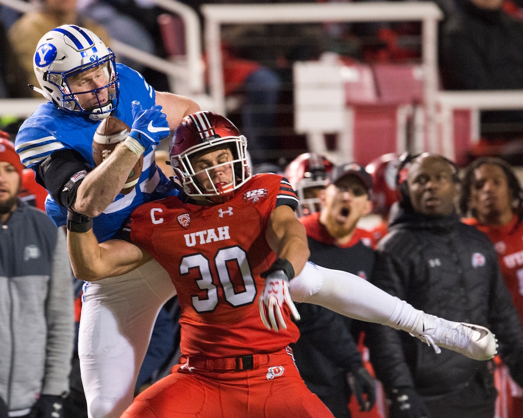 (Rick Egan  |  The Salt Lake Tribune)        Brigham Young Cougars tight end Matt Bushman (89) grabs a one handed pass, as Utah Utes linebacker Cody Barton (30) defends, in football action between the Brigham Young Cougars and the Utah Utes, at Rice-Eccles Stadium, Saturday, November 24, 2018.