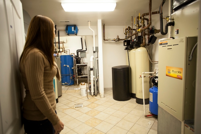 In this April 30, 2018, photo, Jena Jones, Director of the Short Creek Dream Center, guides a tour through the renovated facility, formally the home of polygamous sect leader Warren Jeffs in Hildale, Utah. The sprawling house surrounded by towering brick walls has been converted into a sober living center by Evangelical missionaries, the latest sign of the group’s dwindling control of the small community on the Utah-Arizona border. (Chris Caldwell/The Spectrum via AP)