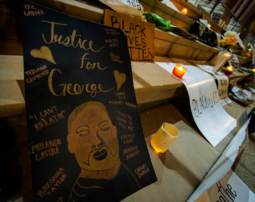 (Rick Egan  |  The Salt Lake Tribune)    Posters, flowers and candles line the steps of the Salt Lake City and County Building late at the evening after all the protesters were gone, Wednesday, June 3, 2020.