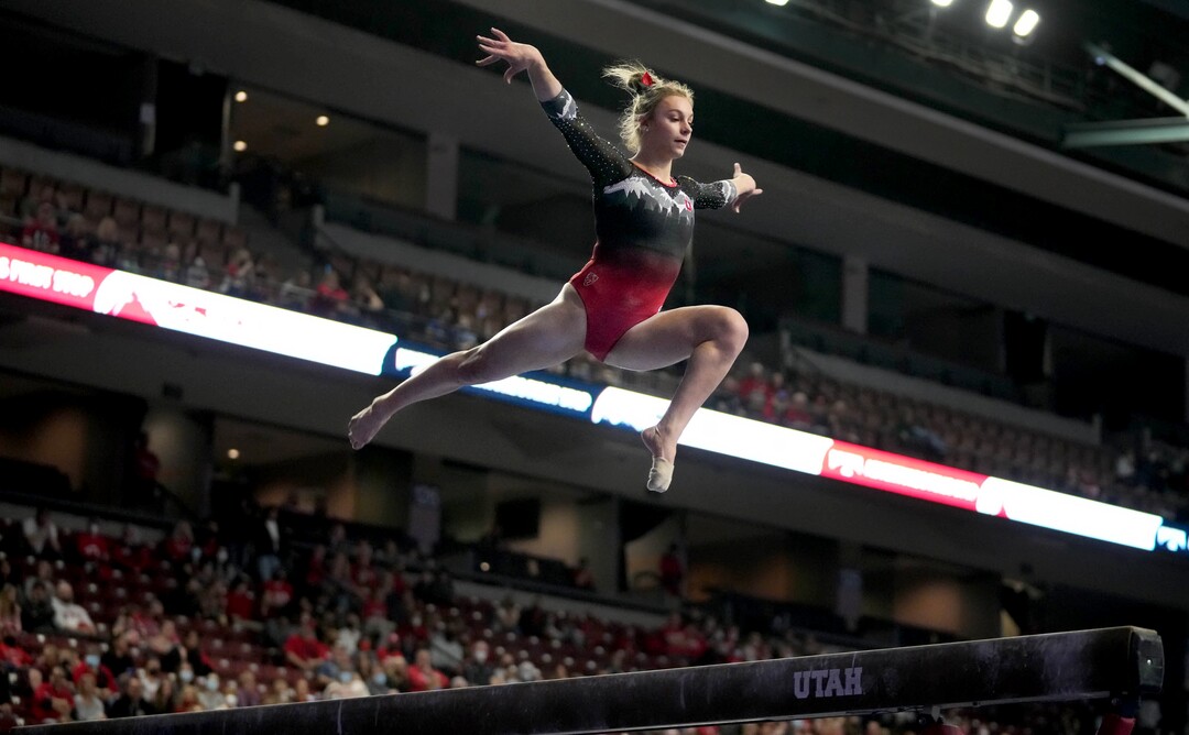 (Francisco Kjolseth | The Salt Lake Tribune) Utah’s Grace McCallum competes on the beam at the Best of Utah NCAA Gymnastics Meet at the Maverik Center in West Valley City on Friday, Jan. 7, 2022.